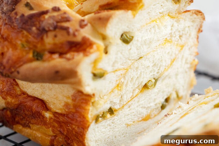 jalapeño cheese bread sliced on cooling rack.