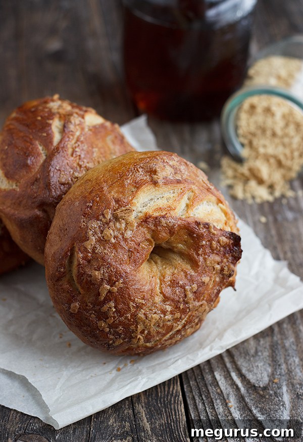 Close-up of baked French Toast Bagels on a cooling rack, showcasing the maple sugar topping