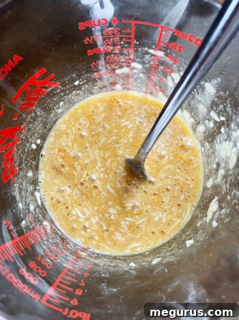 topping mixture mixed in measuring cup, ready to pour