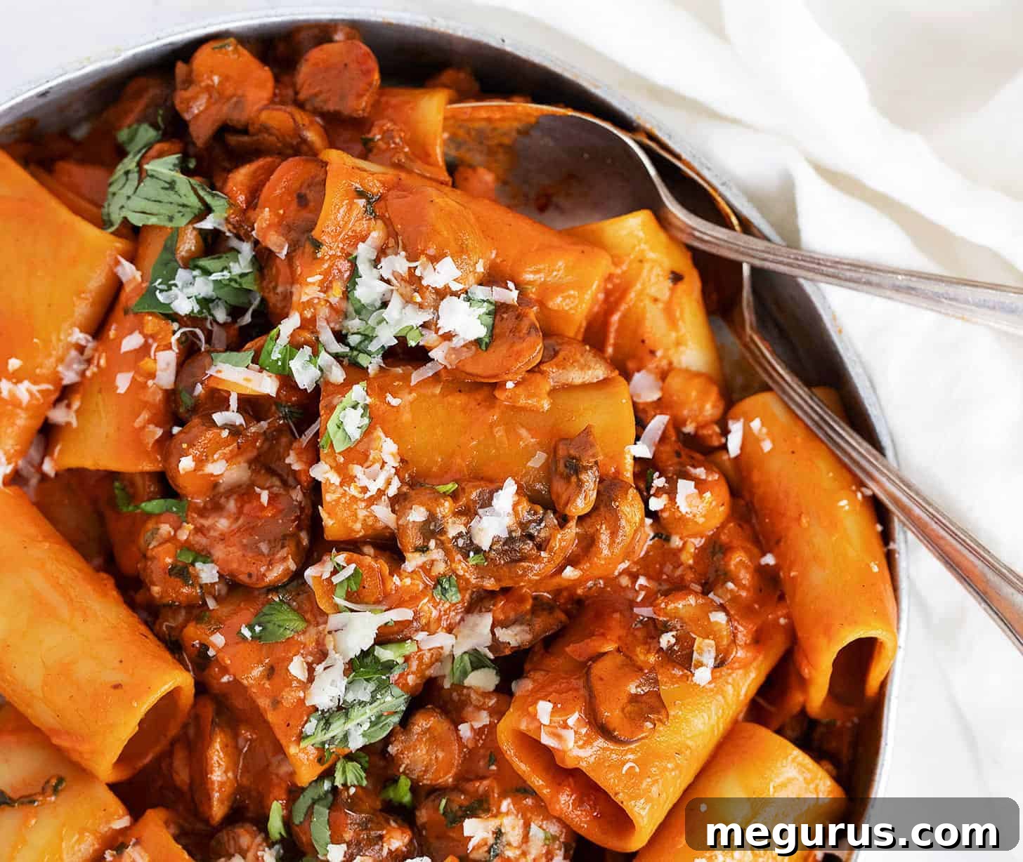 Creamy Mushroom Ragù Pasta served in a large dish, garnished with fresh herbs