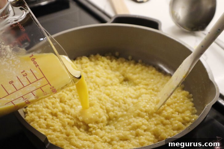 adding egg and cheese