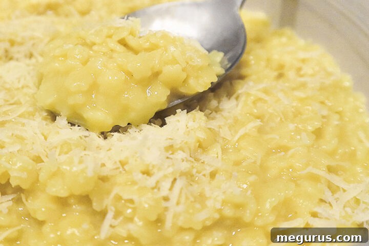 pastina with egg and cheese in bowl with spoon