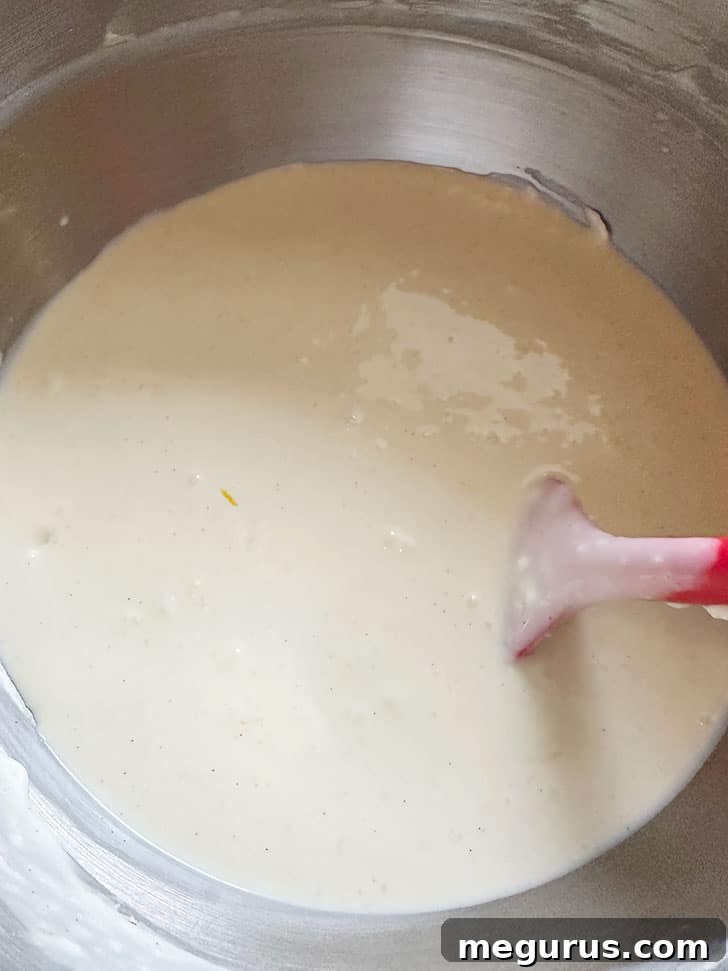 Smooth, liquid cheesecake batter ready for baking.