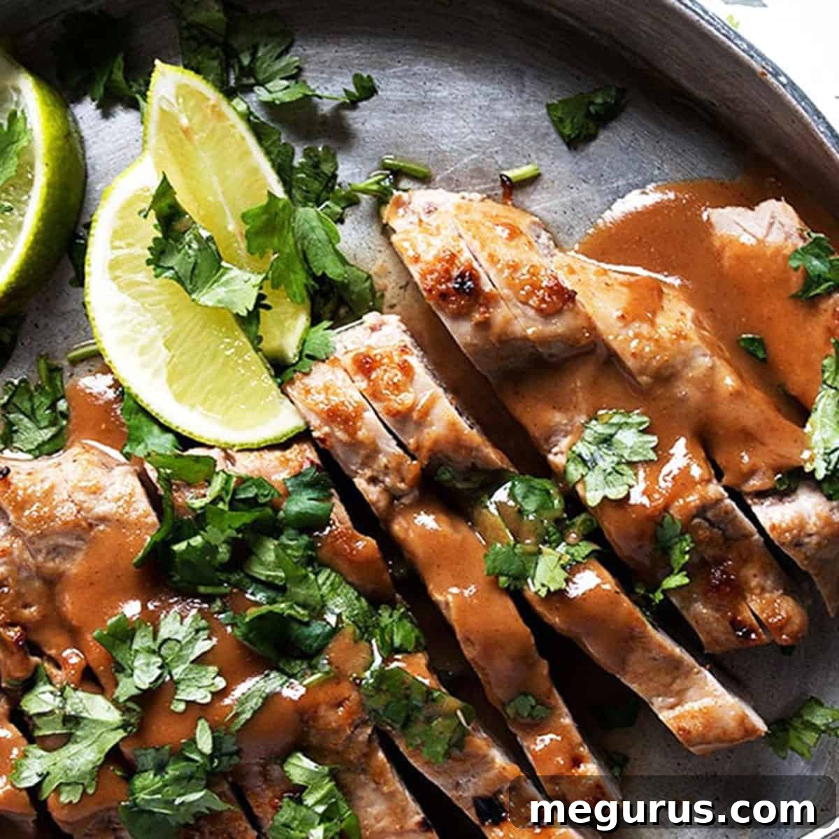 Pork tenderloin sliced with peanut sauce