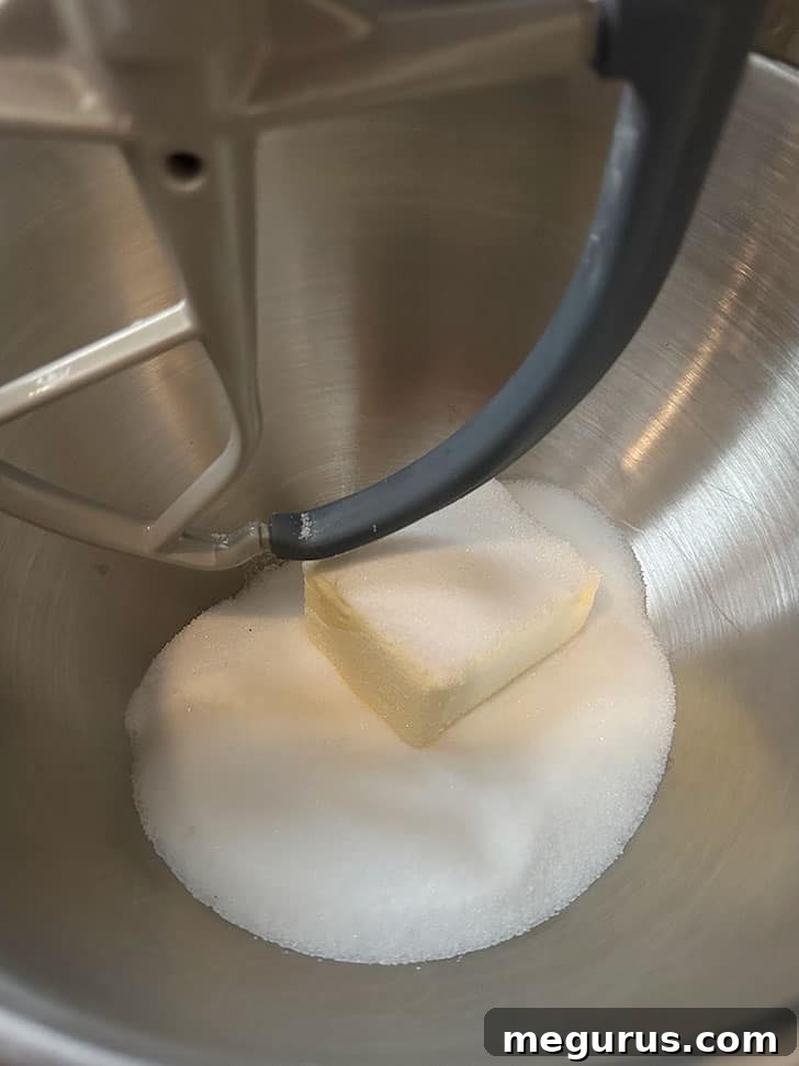 Creaming butter and sugar in a mixing bowl.