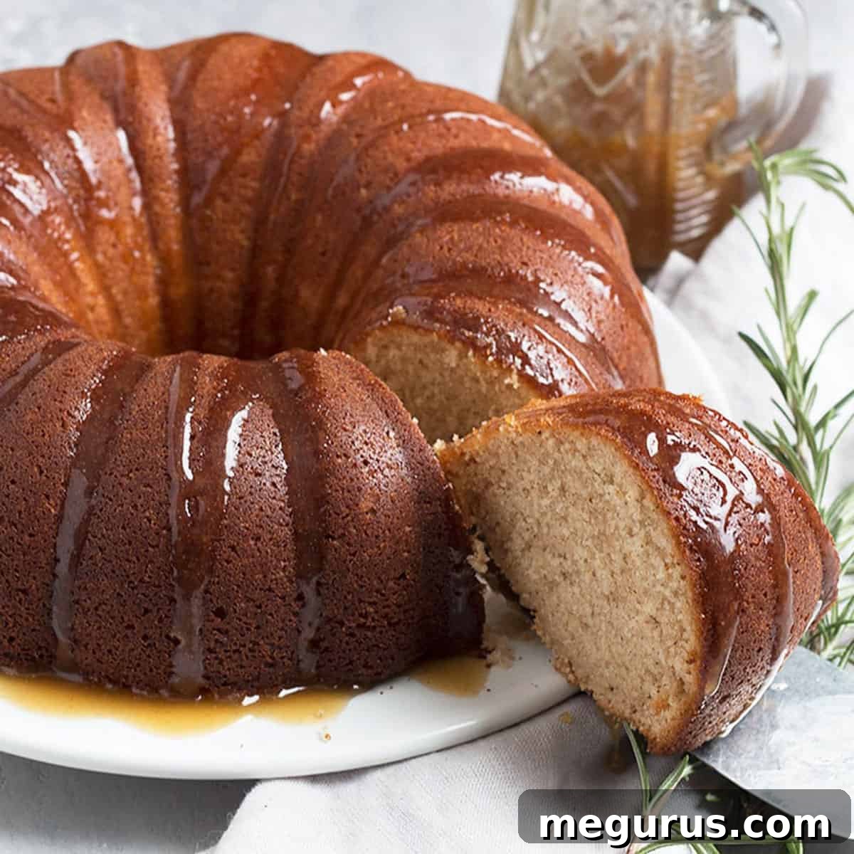 Ginger Bundt Cake sliced with brown sugar sauce