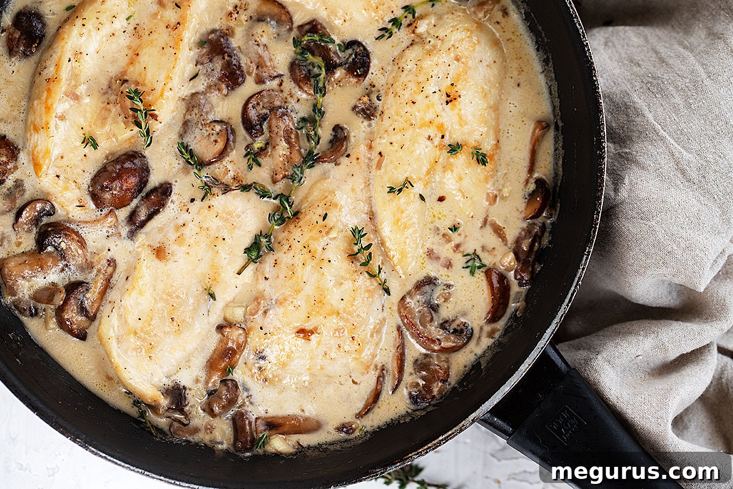 Creamy Garlic Chicken with mushrooms in a rustic skillet, ready to serve.