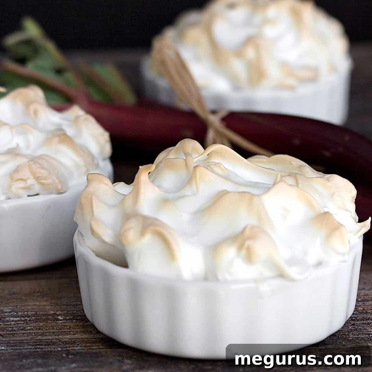 Individual rhubarb meringue dessert tortes in small ramekins.