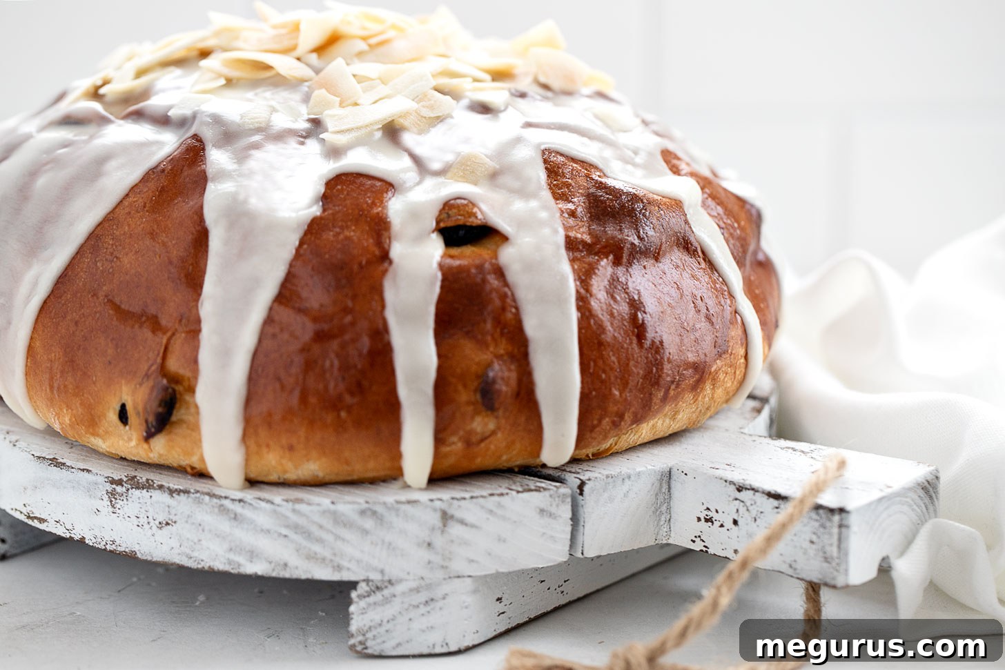 Beautiful cranberry orange yeast bread loaf on a serving platter, ready to be enjoyed.