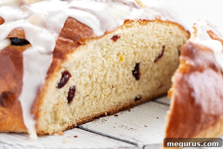 Cranberry orange yeast bread sliced on cutting board