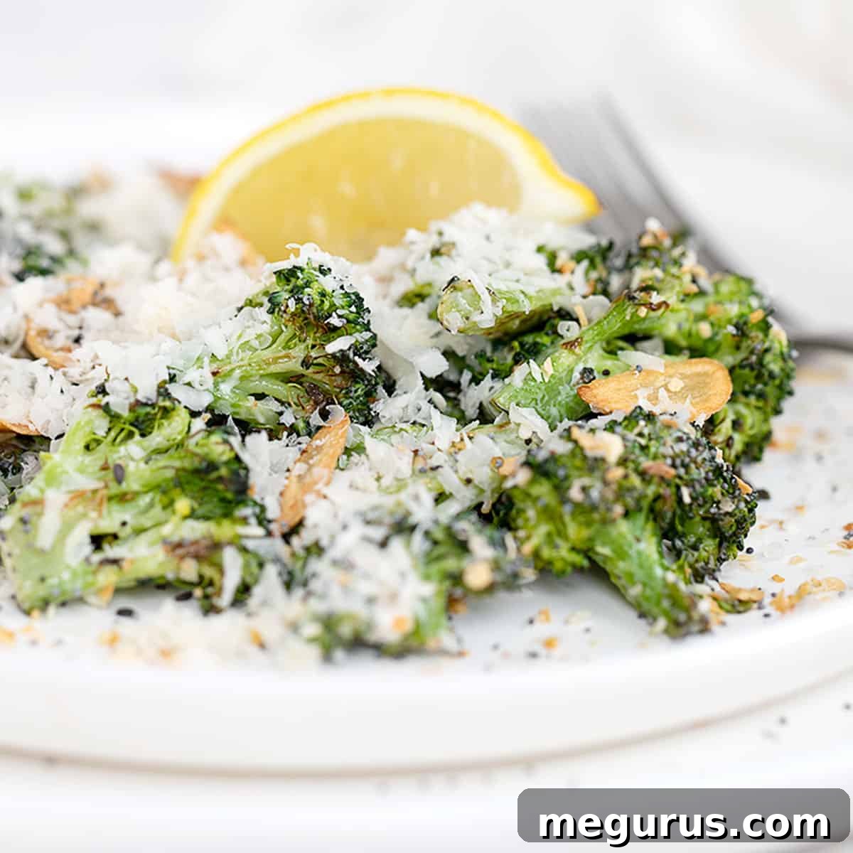 broccoli Caesar salad on plate with lemon