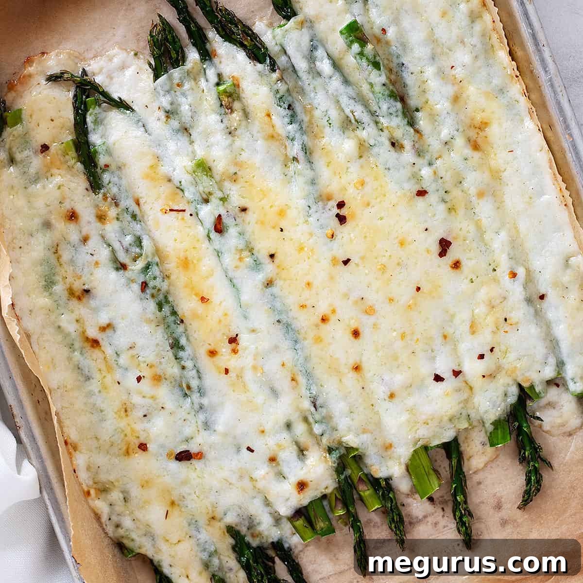 creamy asparagus on baking sheet