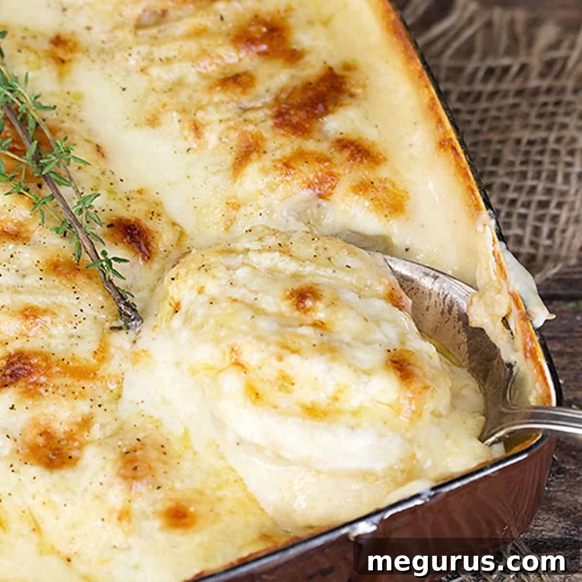 scalloped potatoes with bacon and cheese in casserole dish