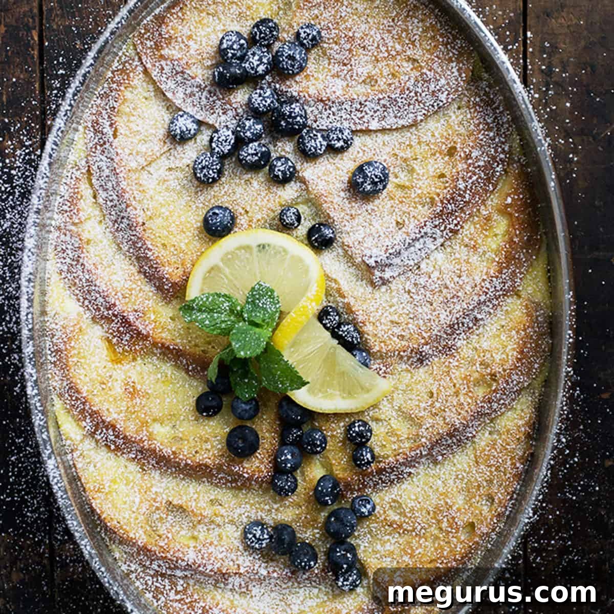 lemon French toast in baking dish with blueberries and lemon slices