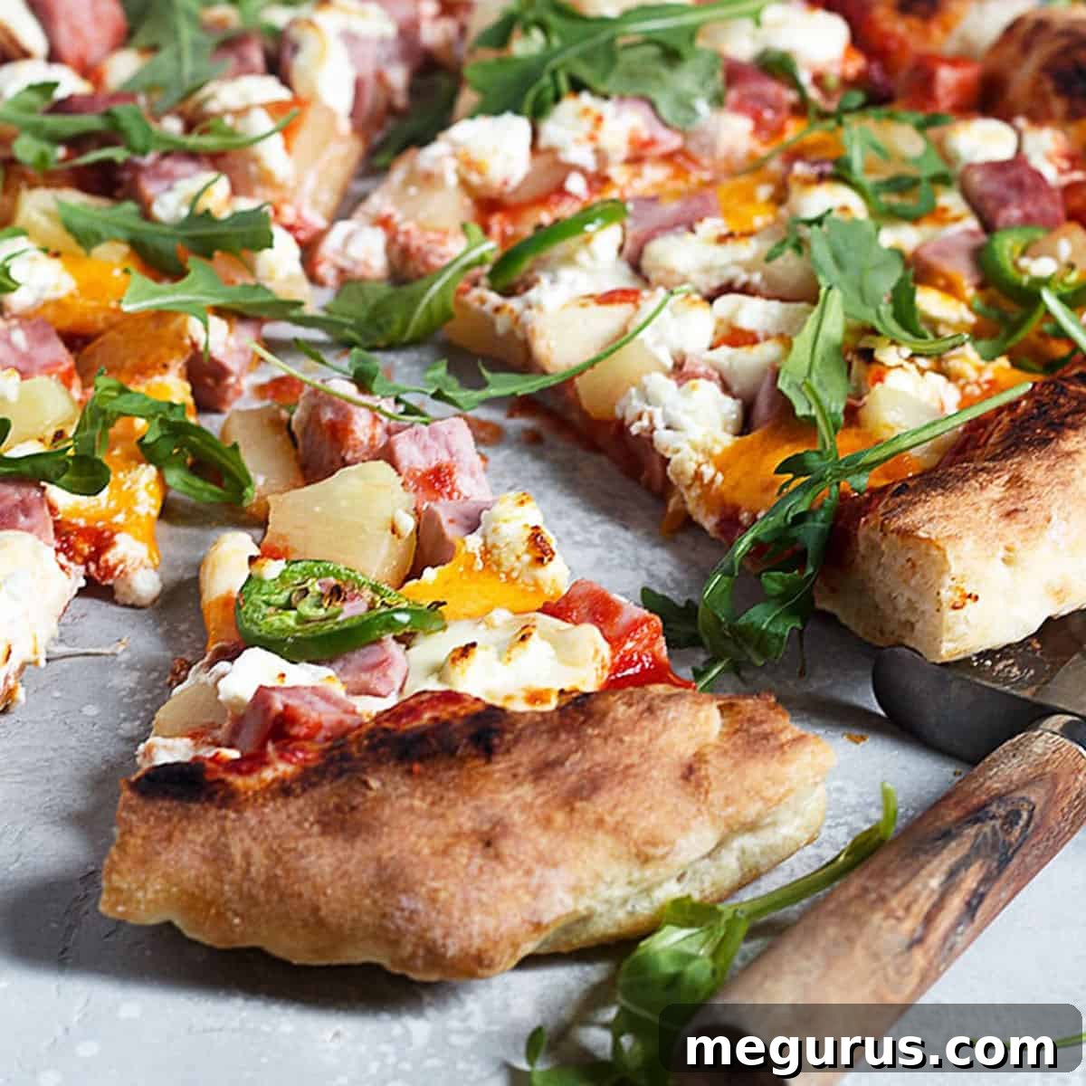 three cheese Hawaiian pizza sliced