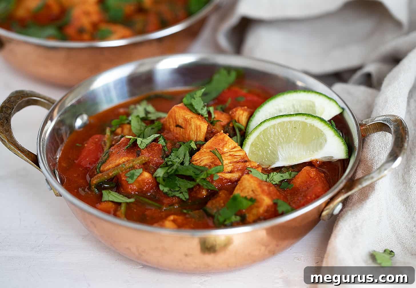 chicken batli in cooper serving dishes