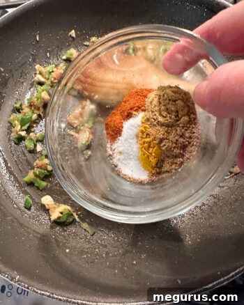 adding spices to skillet