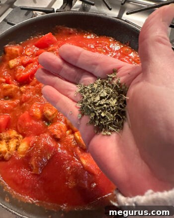 adding fenugreek leaves to skillet