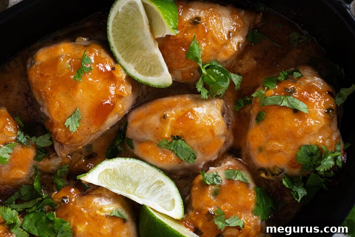 Delicious baked mango chutney chicken in a dish, garnished and ready to be served