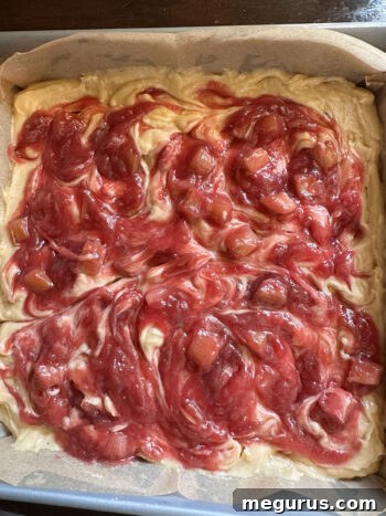 Rhubarb blondies in a baking pan, ready to go into the oven