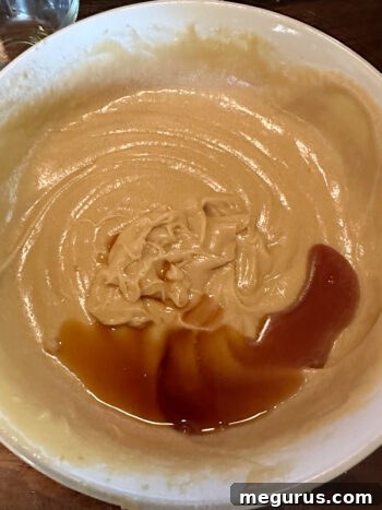 Adding vanilla extract to the blondie batter