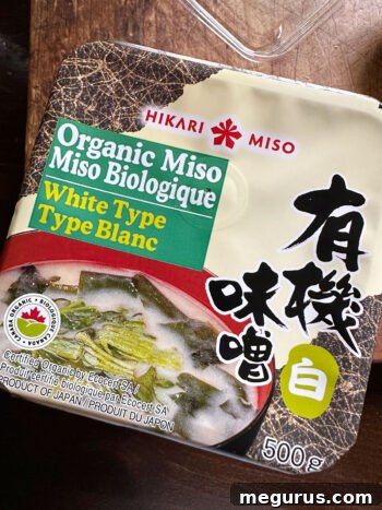 A bowl of white miso paste, a key ingredient for the marinade.