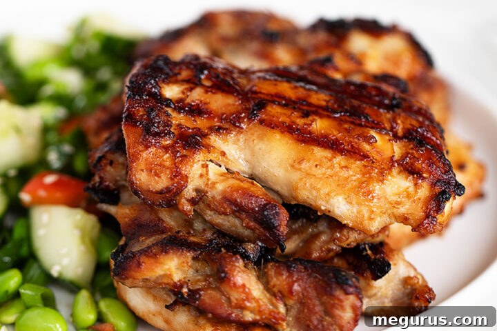 Miso chicken on a plate with an edamame salad