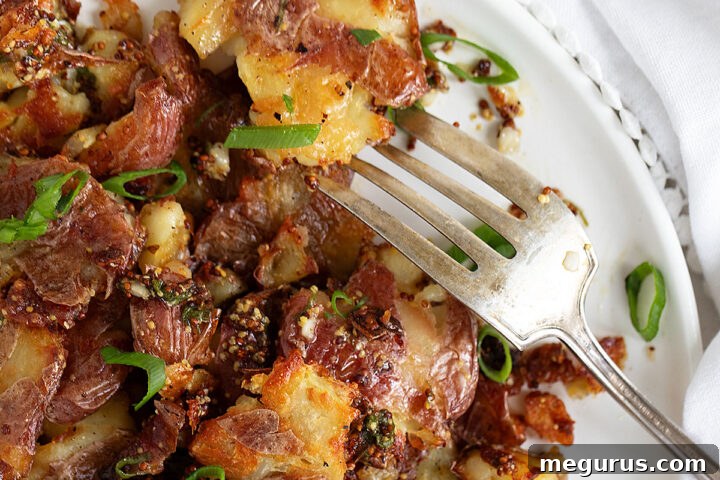 Warm Smashed Potato Salad with a vibrant mustard dressing.