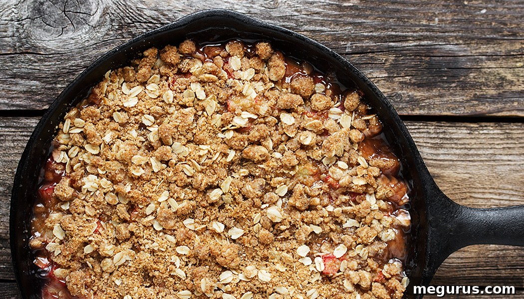 Delicious Skillet Rhubarb Crunch with a golden, crunchy topping and sweet, bubbly rhubarb filling, perfect for a cozy dessert.