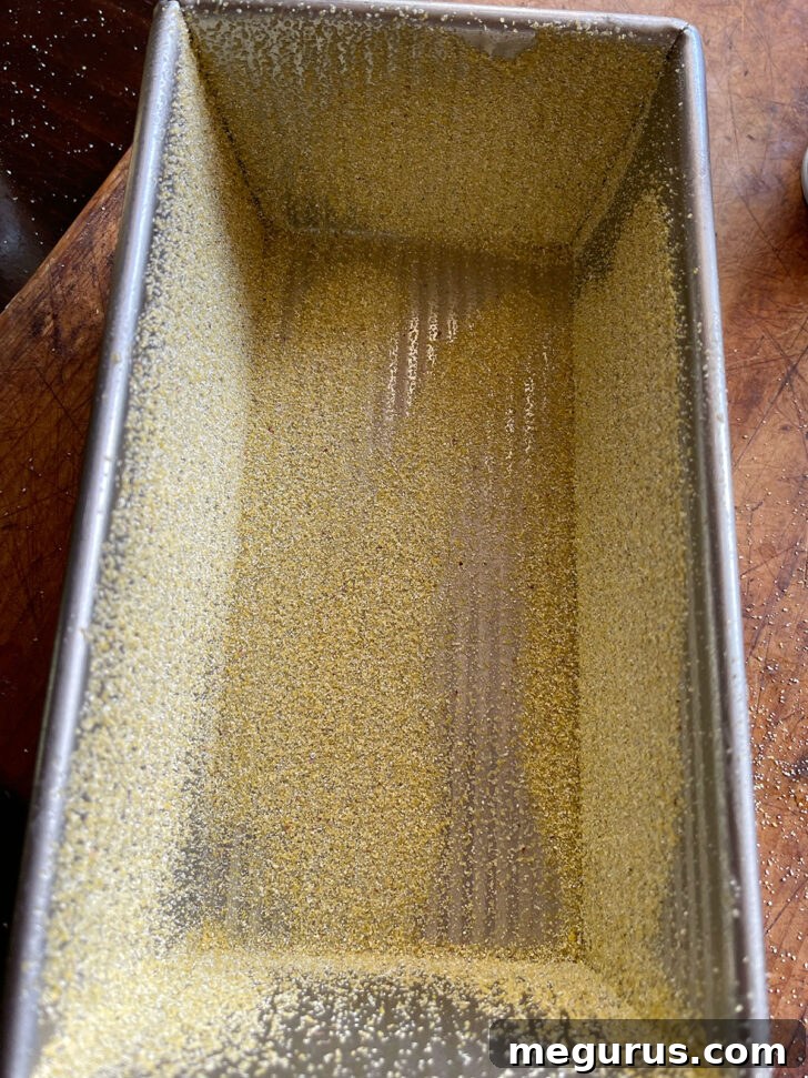 Loaf pan coated with cornmeal, ready for the dough.