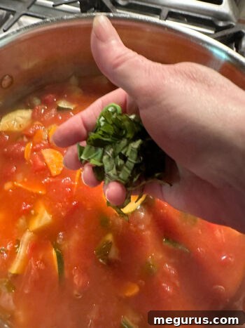 finished soup with more fresh basil