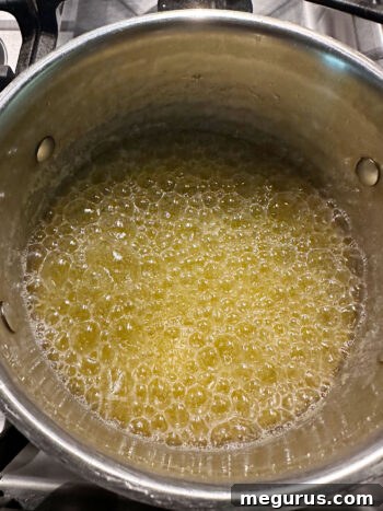 Browned butter with golden-brown specks at the bottom of the saucepan.