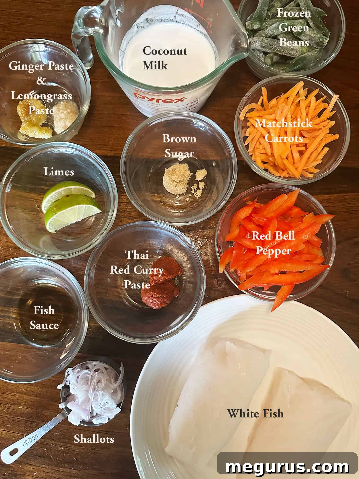 Ingredients laid out for Thai red curry fish preparation