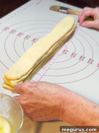 The final stack of buttered dough strips, ready for cutting.