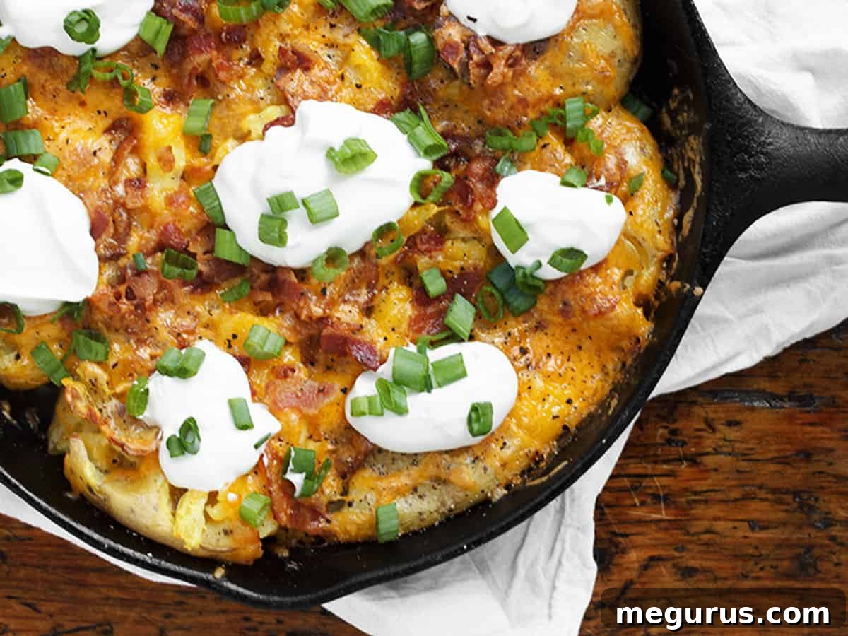 Delicious Loaded Smashed Potato Skillet in a Cast Iron Skillet