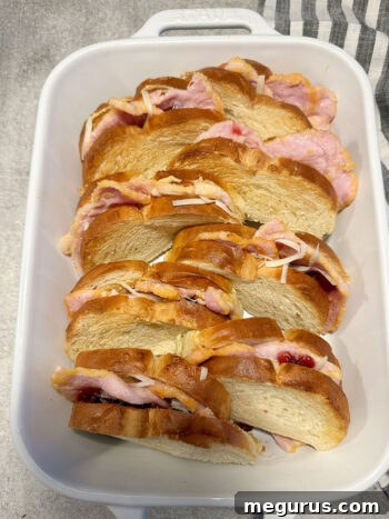 sandwiches neatly placed in a baking dish