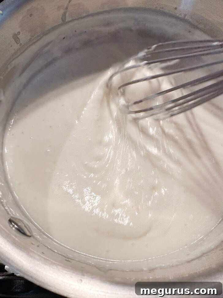 finished Mornay sauce in saucepan, smooth and creamy