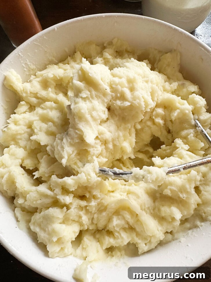 Smooth and creamy mashed potatoes in a bowl