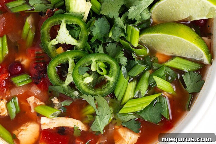 Mexican chicken soup in white bowl