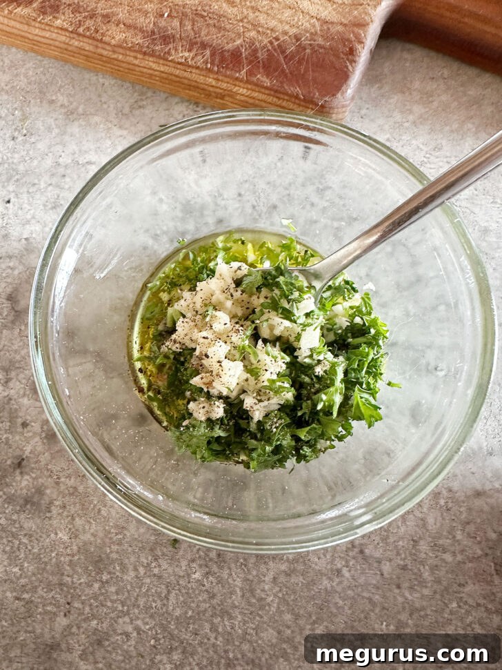 All topping ingredients (olive oil, mayonnaise, Dijon mustard, Worcestershire sauce, minced garlic, chopped parsley, and salt) are placed in a small mixing bowl.