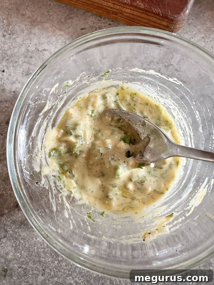 The topping ingredients are stirred together in the small bowl, forming a thick, aromatic paste.