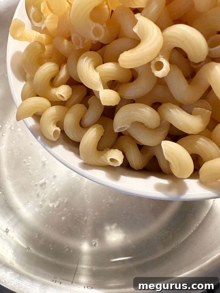 Adding pasta to boiling salted water.