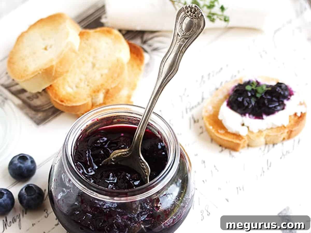 Jar of quick pickled blueberries with crostini, perfect for appetizers