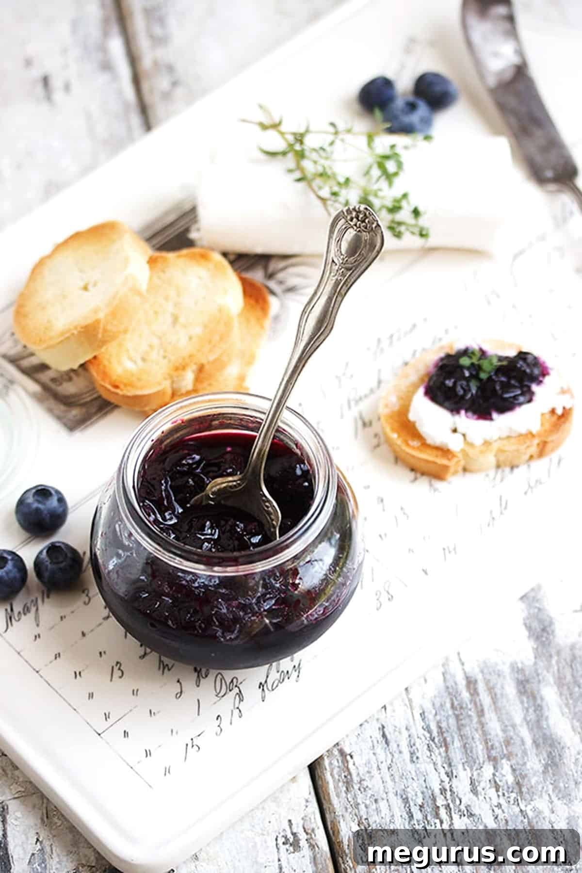 Close-up of quick pickled blueberries in a jar, showcasing their vibrant color and texture