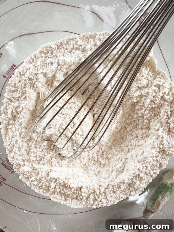 Flour, salt and baking soda whisked in bowl.