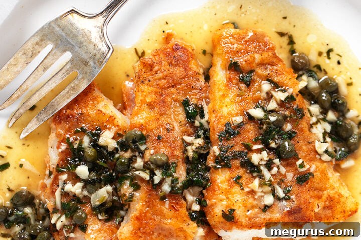 Cod piccata on plate with fork.