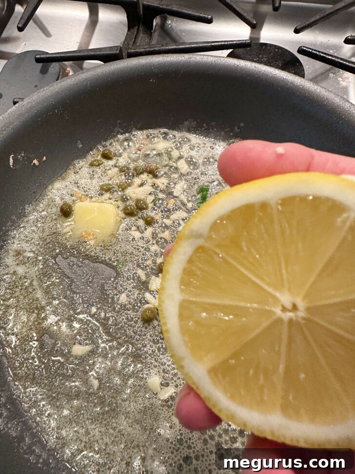 Adding lemon to the sauce in the skillet.