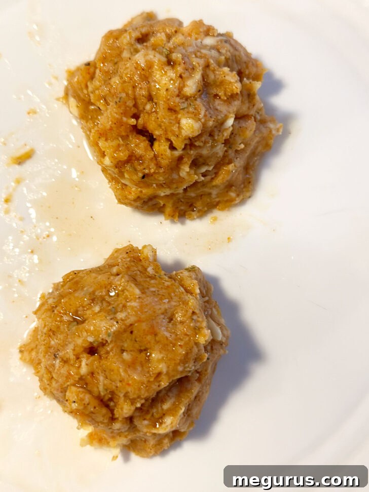 Two dollops of Cajun honey butter on a small plate.