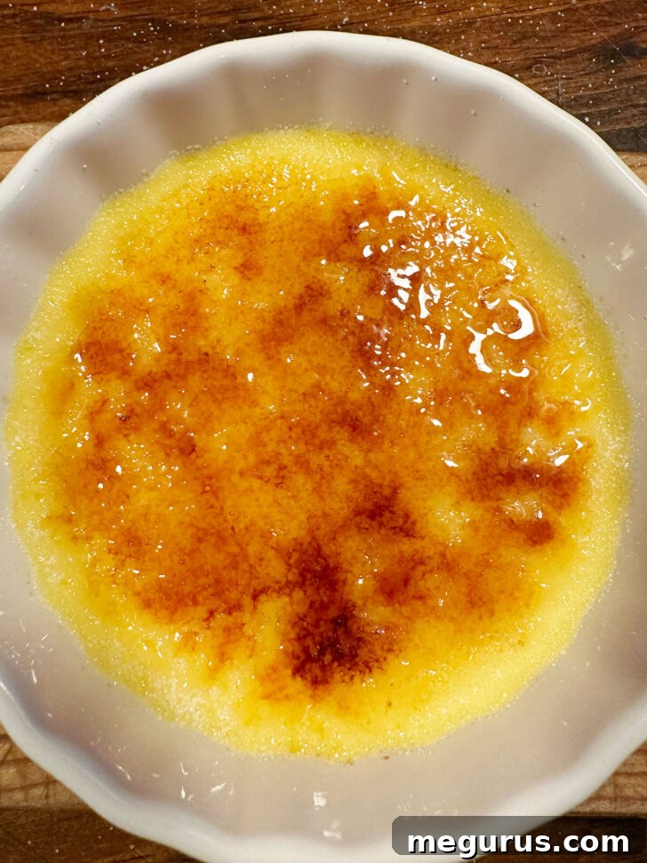 Creme brulee after torching the sugar topping to a perfect golden crisp.