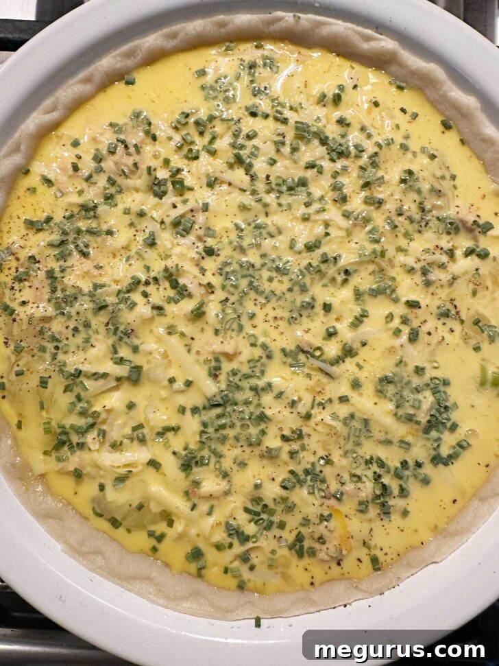 The assembled Salmon Quiche in its pie dish, ready to be placed in the oven for baking.